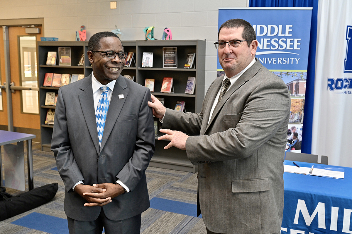 Rockvale High School Principal Steve Luker, right, tells a group of nearly 40 Rockvale students “they can get a quality education (from MTSU) and not have to leave this county” as MTSU President Sidney A. McPhee listens Thursday, March 5, during a partnership agreement signing announcement at the new school in Rockvale, Tenn.(MTSU photo by Andy Heidt)