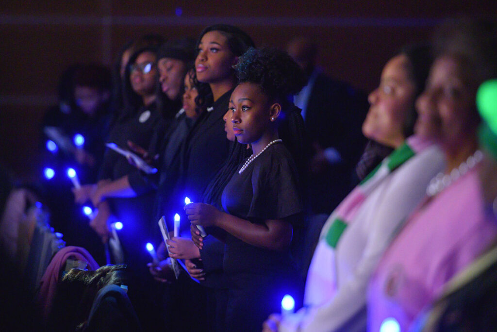 MTSU students and attendees hold their electronic candles during a moment of reflection Monday, Jan. 20, at the 2020 Martin Luther King Jr. Day Candlelight Vigil hosted by Middle Tennessee State University inside the Student Union Ballroom. (MTSU photo by Cat Curtis Murphy)