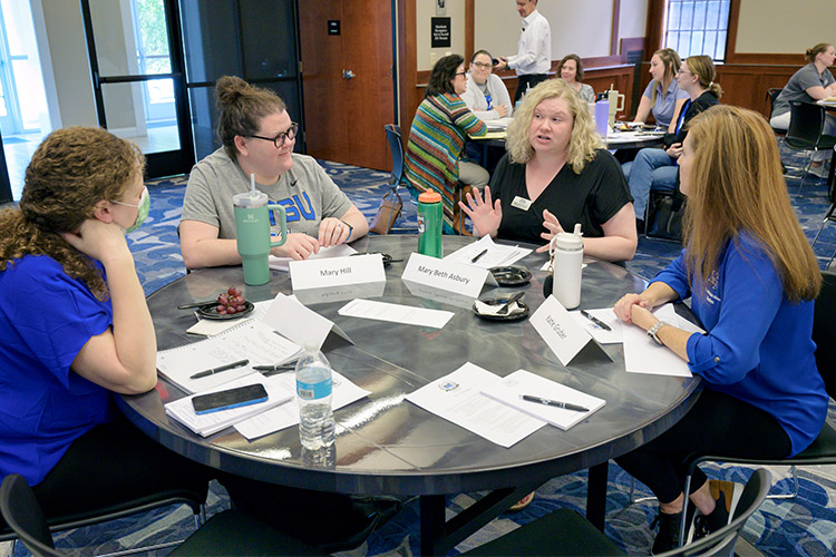 Having a discussion at the MT Engage workshop held Sept. 29, 2023, featuring history professor and keynote speaker Peter Felten, co-author of “Relationship-Rich Education: How Human Connections Drive Success in College,” are, from left, Jennie Bryan, assistant director of employee relations in the Career Development Center; Mary Hill, Communication Studies lecturer; Mary Beth Asbury, Communication Studies department chair; and Katie Gruber, Communication Studies lecturer. (MTSU photo by Andy Heidt)