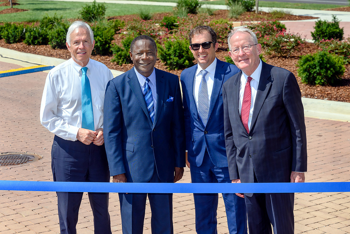 MTSU and the city of Murfreesboro hosted a ribbon-cutting Friday, Aug. 2, to celebrate the completion of an $18.2 million renovation project to Middle Tennessee Boulevard. Preparing to cut the ribbon, from left, are former Congressman Bart Gordon, MTSU President Sidney A. McPhee, Murfreesboro Mayor Shane McFarland and U.S. Sen. Lamar Alexander. (MTSU photo by J. Intintoli)