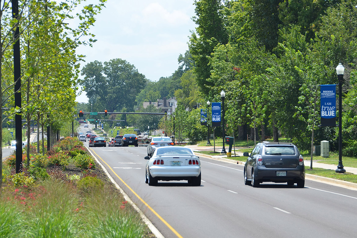 Traffic flows south Friday, Aug. 2, along the upgraded Middle Tennessee Boulevard toward Bell Street at MTSU. The .8-mile stretch between East Main Street and Greenland Drive features four lanes, a landscaped median as well as upgraded crosswalks and traffic signals. MTSU and the city of Murfreesboro hosted a ribbon-cutting Friday to celebrate the completion of an $18.2 million renovation project to Middle Tennessee Boulevard. (MTSU photo by Jimmy Hart)