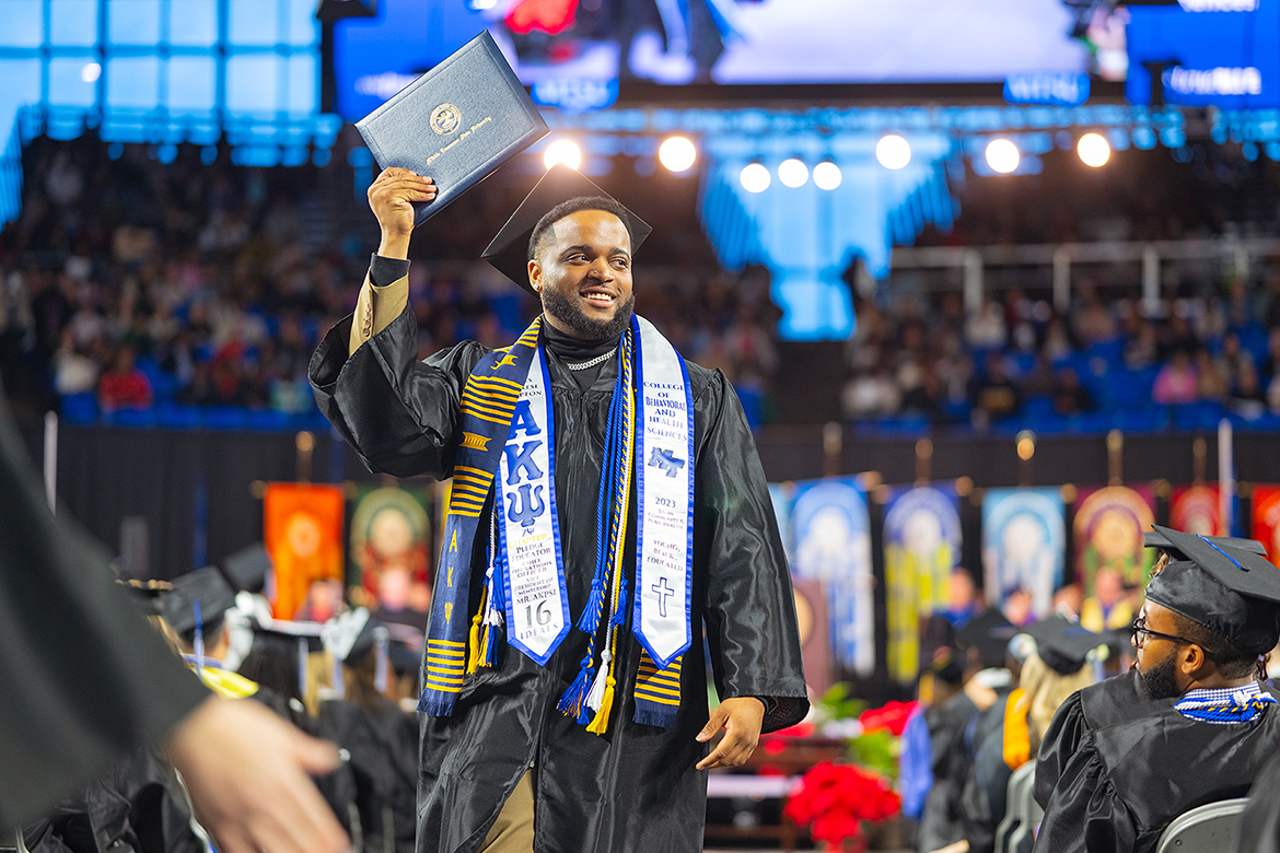 A member of Middle Tennessee State University’s Class of 2023 holds up his diploma during the morning commencement ceremony for fall graduates in Murphy Center. MTSU presented 1,761 undergrad and graduate degrees to students in two ceremonies held Dec. 16. (MTSU photo by Cat Curtis Murphy)