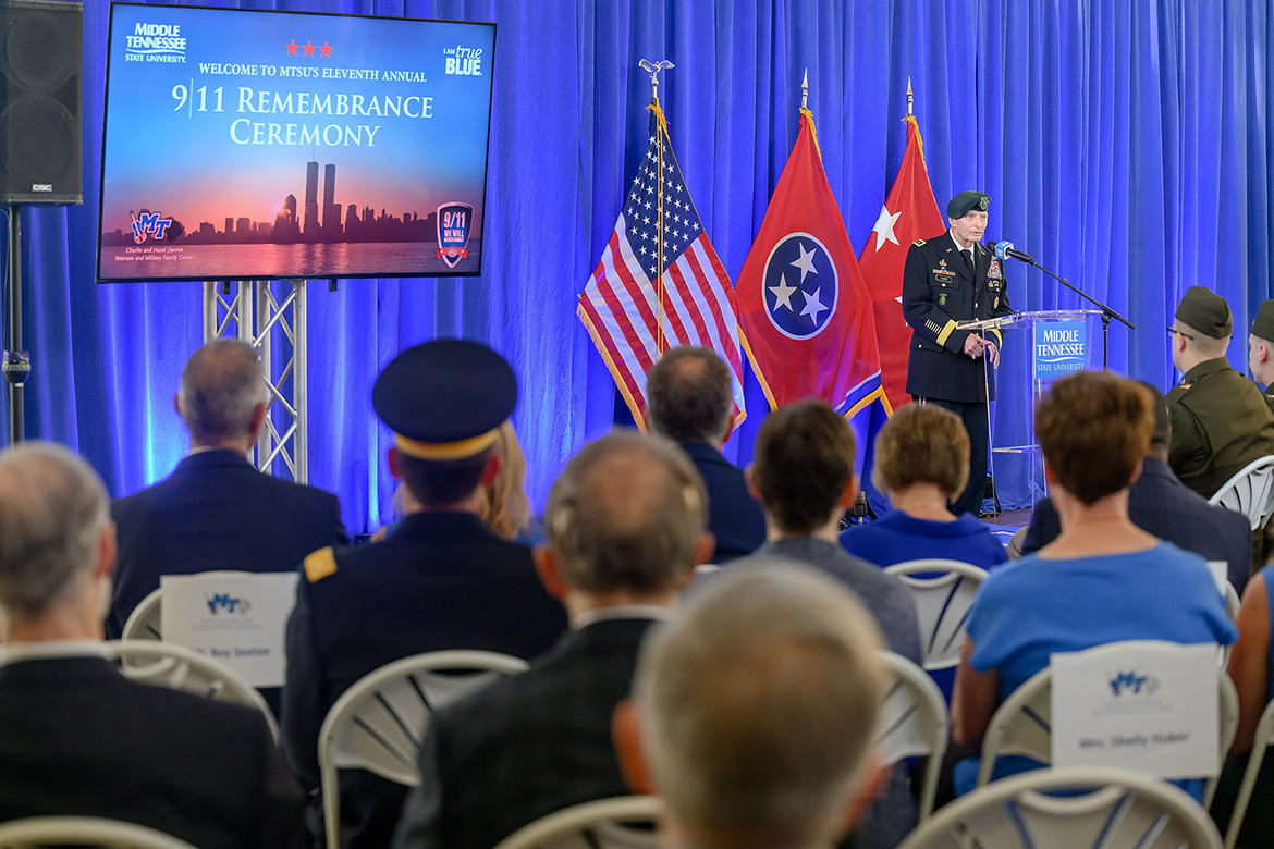 Keith M. Huber, Middle Tennessee State University senior adviser for veterans and leadership initiatives and retired U.S. Army lieutenant general, welcomes the audience and introduces Roy Sexton, U.S. Navy veteran and retired U.S. Secret Service agent, as guest speaker for the 11th annual MTSU 9/11 Remembrance, held in the Miller Education Center second-floor atrium on Bell Street in Murfreesboro, Tenn., on Thursday, Sept. 11. (MTSU photo by J. Intintoli)
