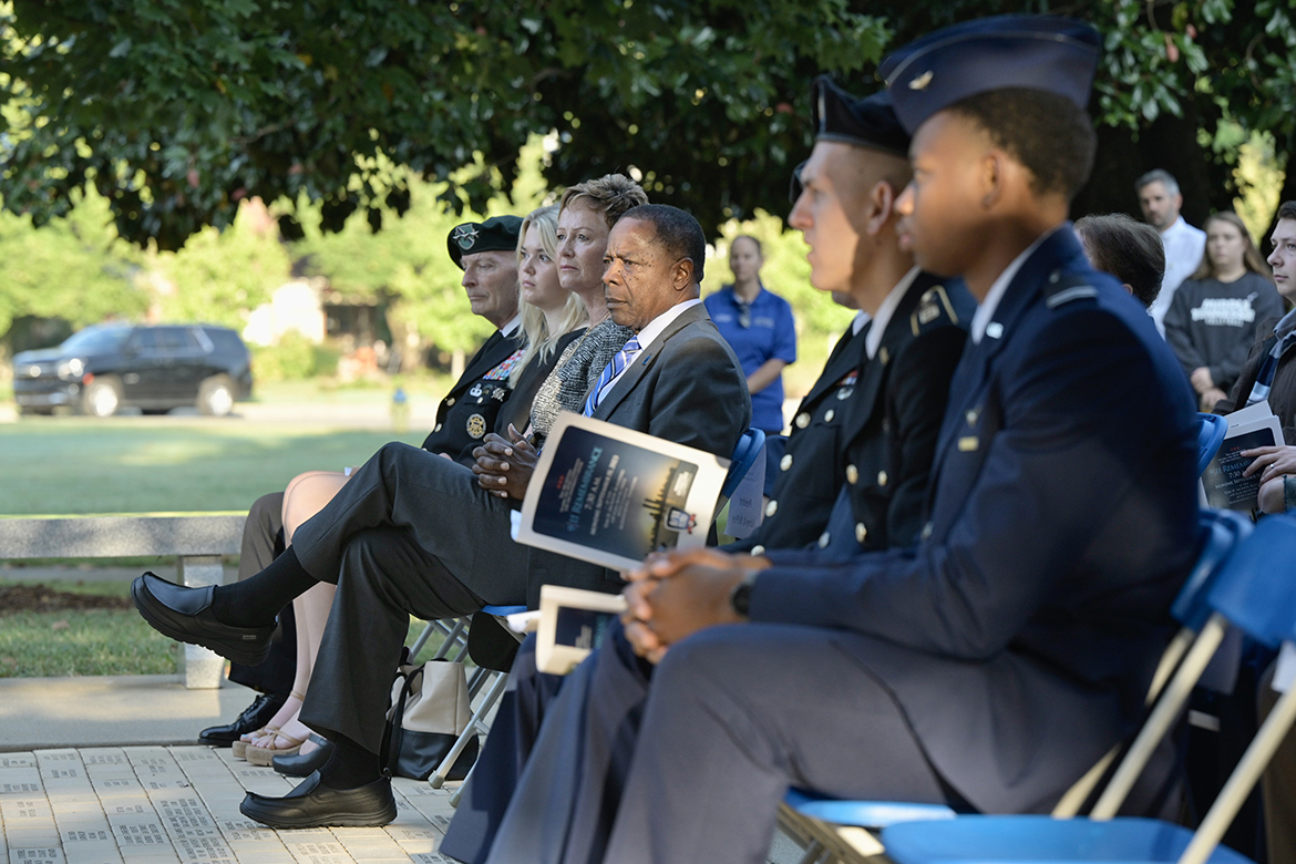 Middle Tennessee State University President Sidney A. McPhee, center, and others listen as Andrew Oppmann, vice president of Marketing and Communications, shares his story from the events that occurred Sept. 11, 2001, and the various military units that took part in the overall mission. Oppmann spoke during the ninth annual 9/11 Remembrance ceremony at the Veterans Memorial outside the Tom H. Jackson Building. (MTSU photo by Andy Heidt)