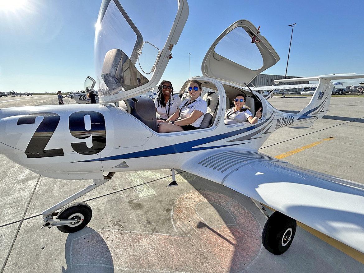 Middle Tennessee State University Department of Aerospace pilots Farilyn Hurt, left, Alyssa Smith and Bri McDonald prepare to take off from the Grand Fork, N.D., airport on a sunny day on Tuesday, June 20, the first day of the annual Air Race Classic for all-women pilots. (MTSU photo by Meredith Boardman)