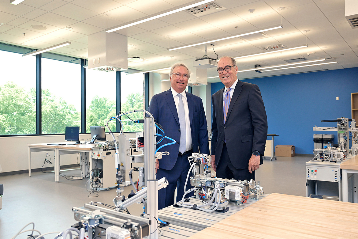 Representing their mother, Jean Gould, brothers Jimmy, left, and Jeff Gould, check out leading edge technology in one of the Middle Tennessee State University Applied Engineering Building Gould Mechatronics Laboratory Wednesday, Aug. 6, in Murfreesboro, Tenn., following the ribbon cutting to help open the $74.8 million, 90,000-square-foot facility for current and future MTSU students and faculty. The Gould’s father, the late Richard “Dick” Gould, was a professor and Industrial Studies chair from 1979-95. (MTSU photo by Andy Heidt)