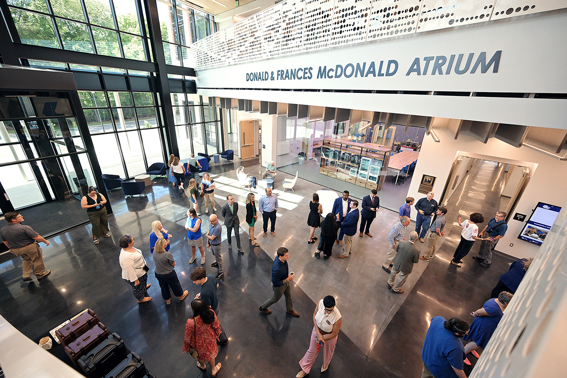 A portion of the crowd of several hundred people attending the ribbon cutting for the new Middle Tennessee State University Applied Engineering Building mills about the Donald and Frances McDonald Atrium Wednesday, Aug. 6, on the east side of campus in Murfreesboro, Tenn. Current and future students will enjoy the 90,000-square-foot facility costing $74.8 million and featuring cutting-edge technology, much of it provided by industry partners. (MTSU photo by Andy Heidt)
