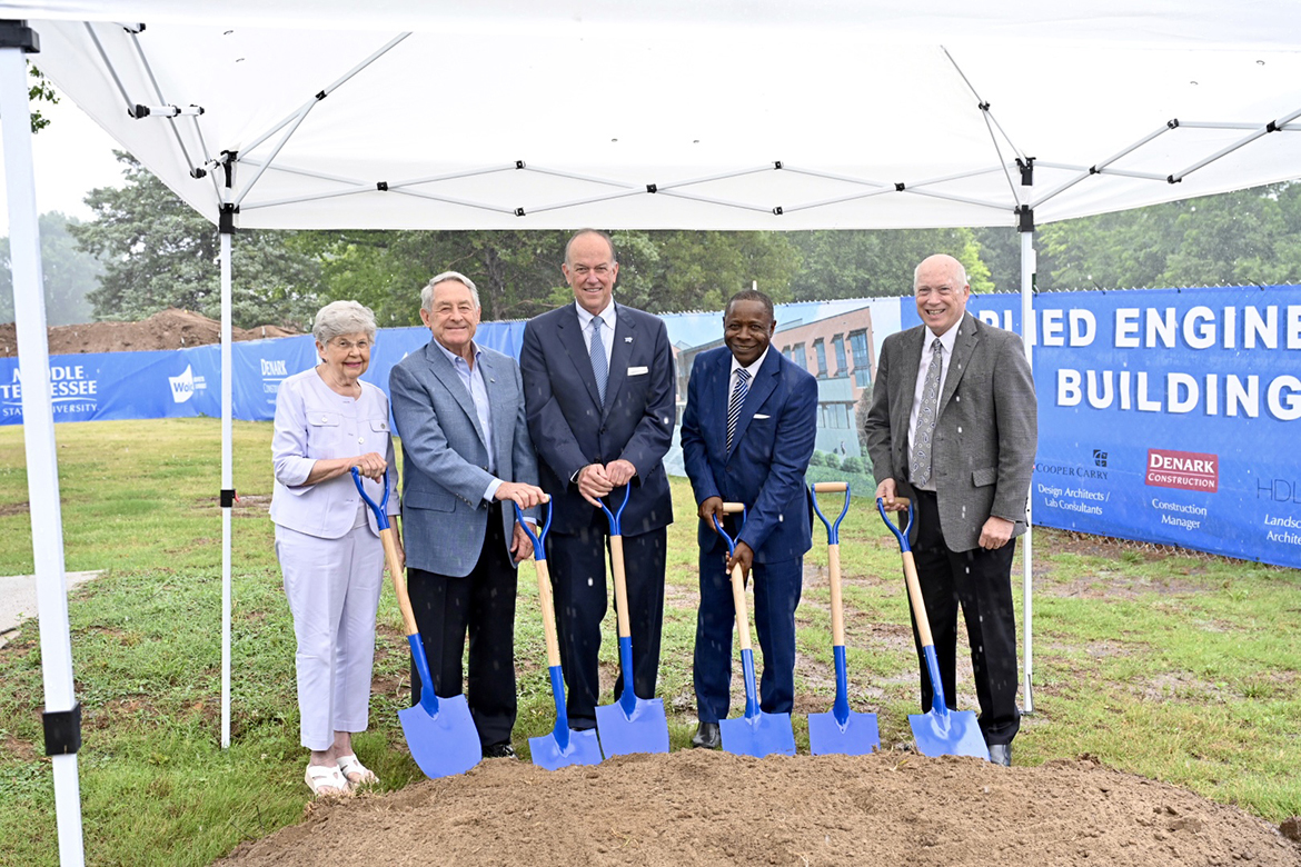 From left, Frances McDonald, alumnus Donald McDonald, alumnus and MTSU Board of Trustees Chairman Steve Smith, MTSU President Sidney A. McPhee and Ken Currie, chair of the Department of Engineering Technology, perform the ceremonial shoveling of dirt during the Applied Engineering Building groundbreaking event Tuesday, June 20, near the location for the new building, which is scheduled for completion in summer or fall 2025 at Blue Raider and Alumni drives. (MTSU photo by J. Intintoli)