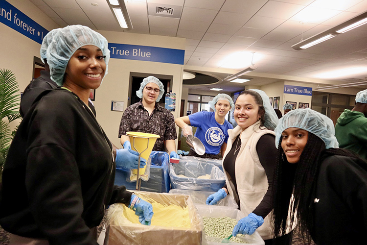 A group from the more than 80 Middle Tennessee State University student volunteers assist in packing 15,000 meals filled with a variety of nonperishable items as part of the university’s annual Big Event community service project held Wednesday, Feb. 21, in the Student Union Building. Organizers said most of the meals will be donated to the MTSU Food Pantry and the remainder will be donated to Nourish Food Bank. (MTSU photo courtesy of Jackie Victory)
