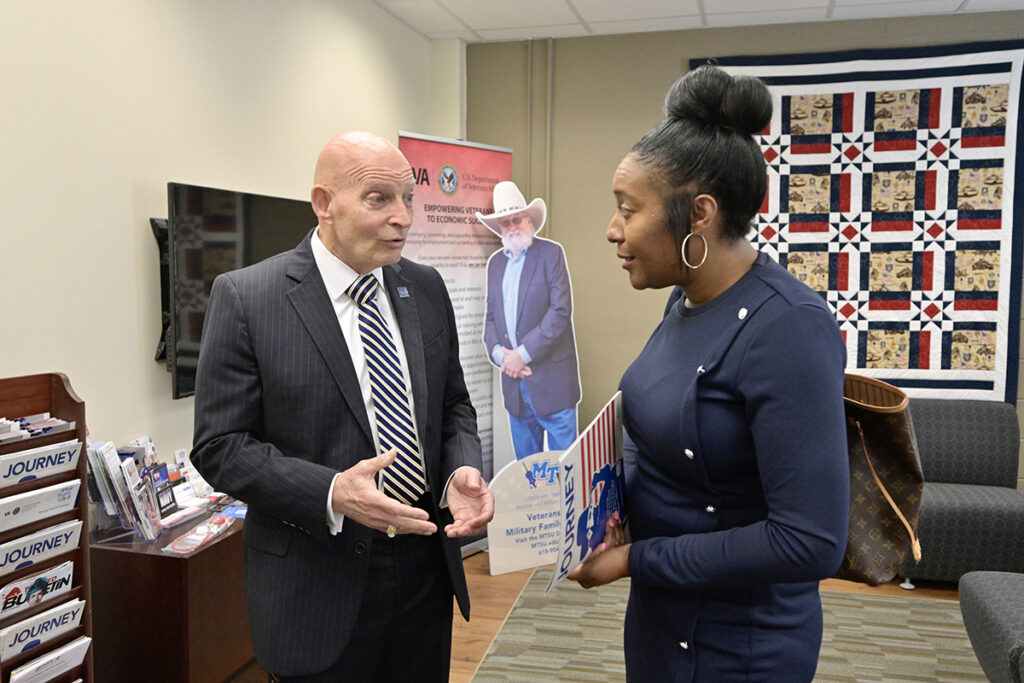 Keith M. Huber, left, MTSU senior adviser for veterans and leadership initiatives, and Stacey Nickens, associate vice president for corporate communications with Metropolitan Nashville Airport Authority, talk about the strong interest the late hall of fame entertainer Charlie Daniels and the Journey Home Project had with the Daniels Veterans Center. BNA gave the center a $10,000 donation from proceeds from an airport authority golf tournament. (MTSU photo by Andy Heidt)