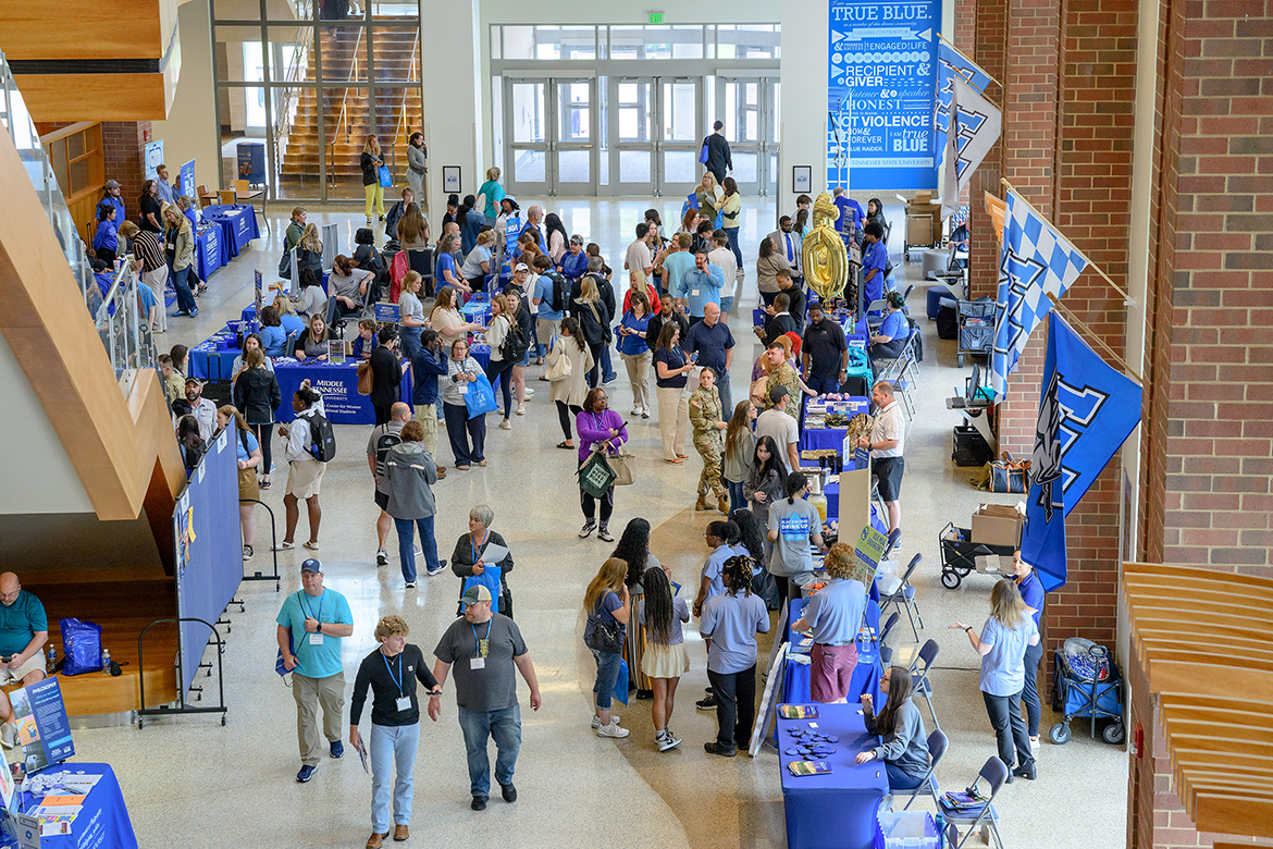 Attending a yard party that moved indoors to the Student Union atrium areas because of the weather, new Middle Tennessee State University students and their parents browse the variety of offerings available to them on campus in Murfreesboro, Tenn. CUSTOMS orientation will be held throughout the spring and summer for new freshmen and transfer students. (MTSU photo by J. Intintoli)