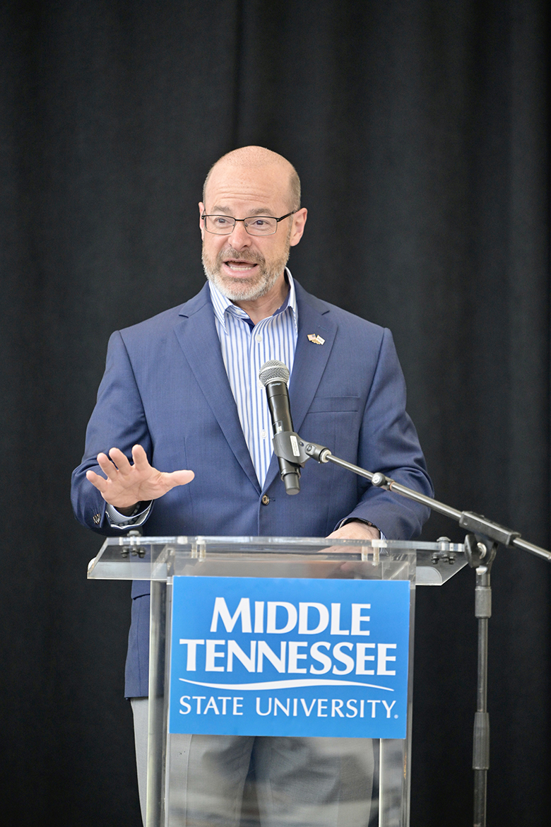 Chris Jones, president and CEO of Middle Tennessee Electric in Murfreesboro, Tenn., welcomes utility company employee-veterans and others to the luncheon and VA benefits session Tuesday, April 23, at the Middle Tennessee State University Miller Education Center on Bell Street in Murfreesboro, Tenn. Attendees from United Communications, Consolidated Utility District of Rutherford County and Middle Tennessee Electric learned about VA benefits they could be receiving. (MTSU photo by Andy Heidt)
