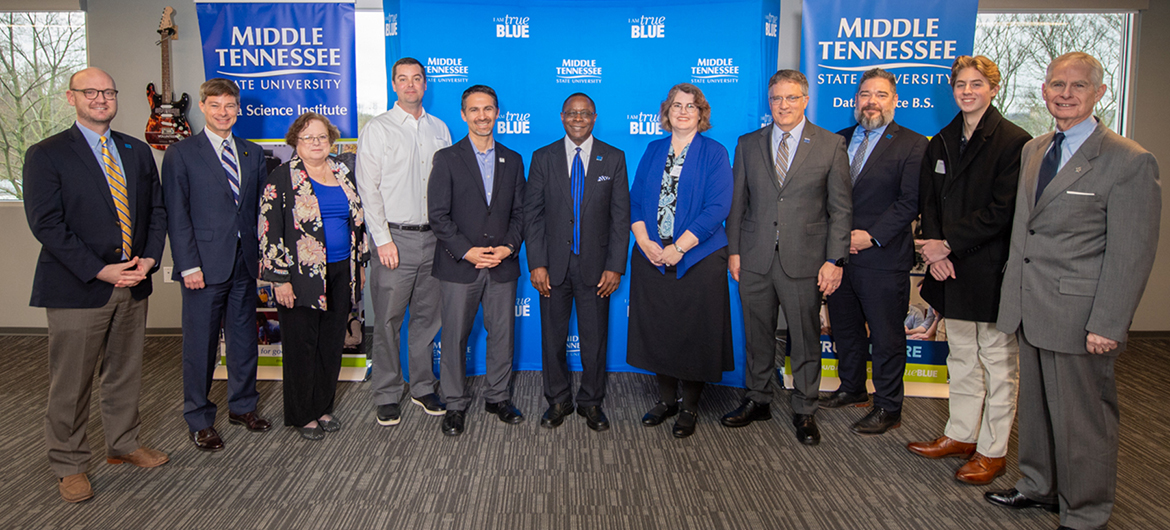 MTSU President Sidney A. McPhee, center, is joined by university faculty and staff as well as other supporters at the kickoff of the university’s Tennessee Data Initiative held Tuesday, Feb. 18, at the Nashville Technology Council’s headquarters. Pictured, from left, are Mike Krause, executive director of the Tennessee Higher Education Commission; state Rep. Charlie Baum, an MTSU finance professor; Mary Martin, MTSU mathematics professor and Board of Trustee faculty representative; Ryan Otter, MTSU biology professor and co-director of the MTSU Data Science Institute; Charlie Apigian, information systems and analytics professor and co-director of the Data Science Institute; MTSU President Sidney A. McPhee; Lisa Green, interim chair of mathematical sciences; MTSU Provost Mark Byrnes; David Butler, dean of the College of Graduate Studies; Cayson Seipel, MTSU freshman information systems major; and Tom Boyd, Board of Trustees member. (MTSU photo by James Cessna)