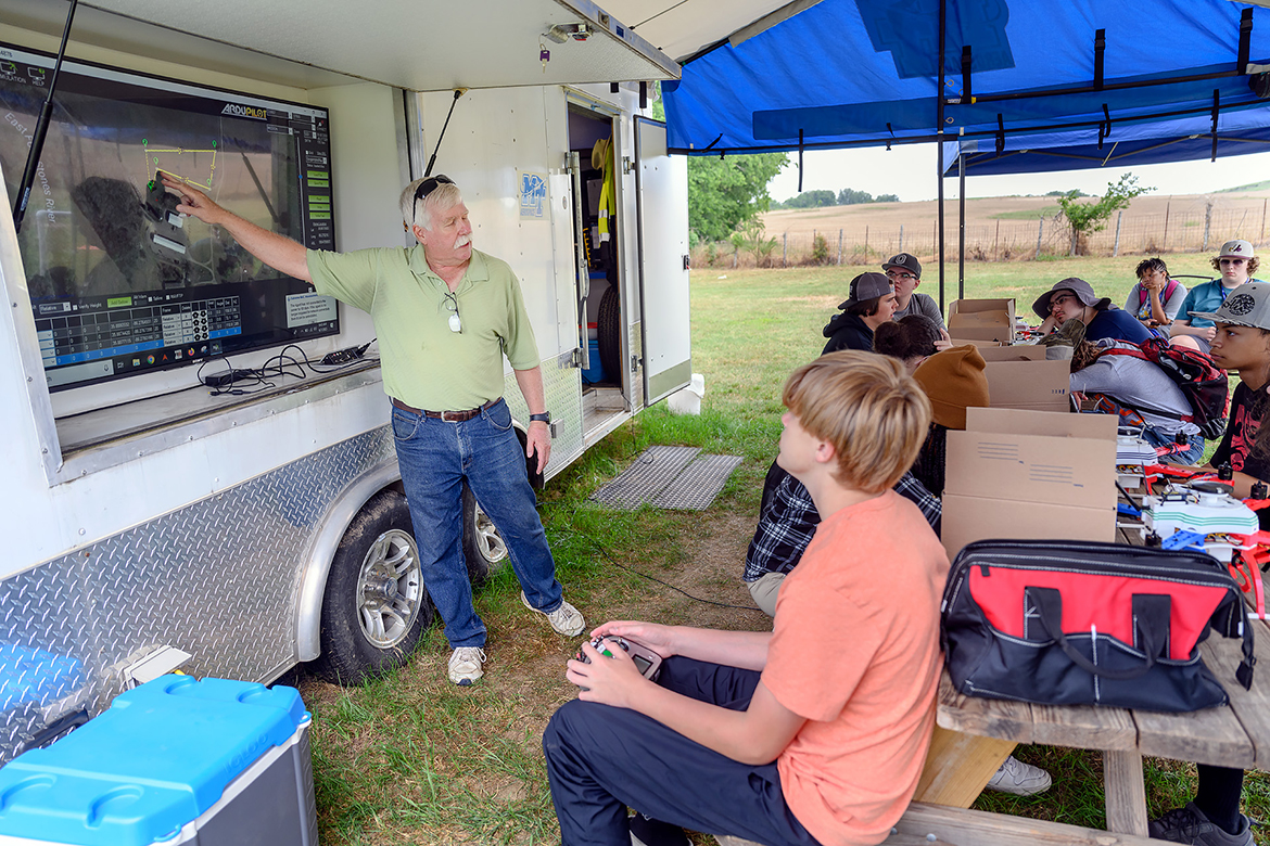 Kevin Corns, Middle Tennessee State University associate professor and director the Aerospace Department’s unmanned aircraft systems program, uses sophisticated technology to show the Digital Agriculture campers how to map locations to fly drones to collect data at the MTSU Farm in Lascassas, Tenn. Sixteen area high school students attended the nearly three-week camp. (MTSU photo by J. Intintoli)