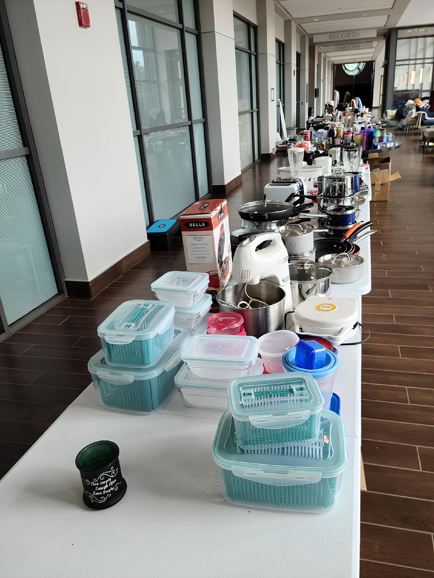 Tables full of new, used and gently used household items lined the hallway at the MTSU Student Services and Admissions Center for the recent Free Cycle event to donate free items to 200 MTSU students. About 50 students later received food from the MTSU Pantry. (MTSU photo by Bonnie McCarty)