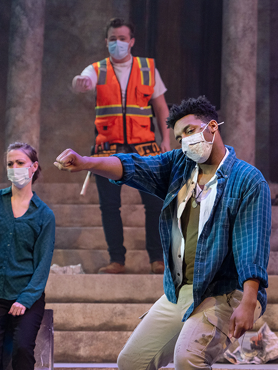 MTSU senior Caleb Mitchell of Antioch, Tenn., gestures during dress rehearsal Monday, April 5, in Tucker Theatre for MTSU Theatre's spring production of "Godspell." Mitchell, a theatre major, is portraying Jesus in the Tony-nominated musical, which will be presented live online April 8-11. Also shown are junior Kassandra Hazard of Sevierville, Tenn., a production understudy, and senior Kaleb Stone of Spring Hill, Tenn., who is portraying John the Baptist and Judas in the show. Tickets are available at http://www.Showtix4u.com/Events/MTSUTheatre. (MTSU photo by Cat Curtis Murphy)