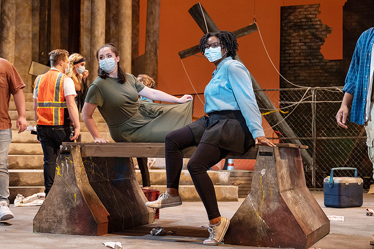 MTSU juniors Aubrey Zurhellen of Covington, Tenn., and Stokeley Ellison of Friendship, Tenn., listen attentively to director Kristi Shamburger during dress rehearsal Monday, April 5, in Tucker Theatre for MTSU Theatre's spring production of "Godspell." The crumbling cityscape set, designed by senior Maggie Shivers of Kingston Springs, Tenn., is the backdrop for the live online performances April 8-11, and tickets are available at http://www.Showtix4u.com/Events/MTSUTheatre. (MTSU photo by Cat Curtis Murphy)
