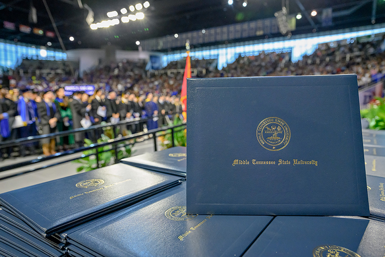 A stack of diploma covers await to be handed out during Middle Tennessee State University’s 2023 summer commencement ceremony inside Murphy Center on the MTSU campus in Murfreesboro, Tenn. Fall 2023 ceremonies will be held Saturday, Dec. 16, for the more the 1,760 graduates. (MTSU file photo by J. Intintoli)