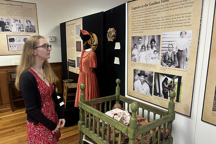 Middle Tennessee State University public history graduate student Paige Hurley of Franklin, Tenn., examines one of the exhibits at the Heritage Center, located at 225 W. College St. in downtown Murfreesboro, Tenn. The center is operated by MTSU’s Center for Historic Preservation and will be a tour stop for the annual Lifelong Learning Program set for 9 a.m. to noon Wednesday, Aug. 20. (MTSU photo by Nancy DeGennaro)