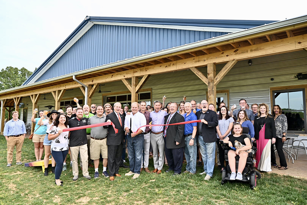 Invited guests, MTSU staff and administrators and Hop Springs owners and personnel participate in the Rutherford County Chamber of Commerce ribbon-cutting Thursday, May 23, to celebrate the grand opening of the facility and partnership with MTSU fermentation science. (MTSU photo by J. Intintoli)