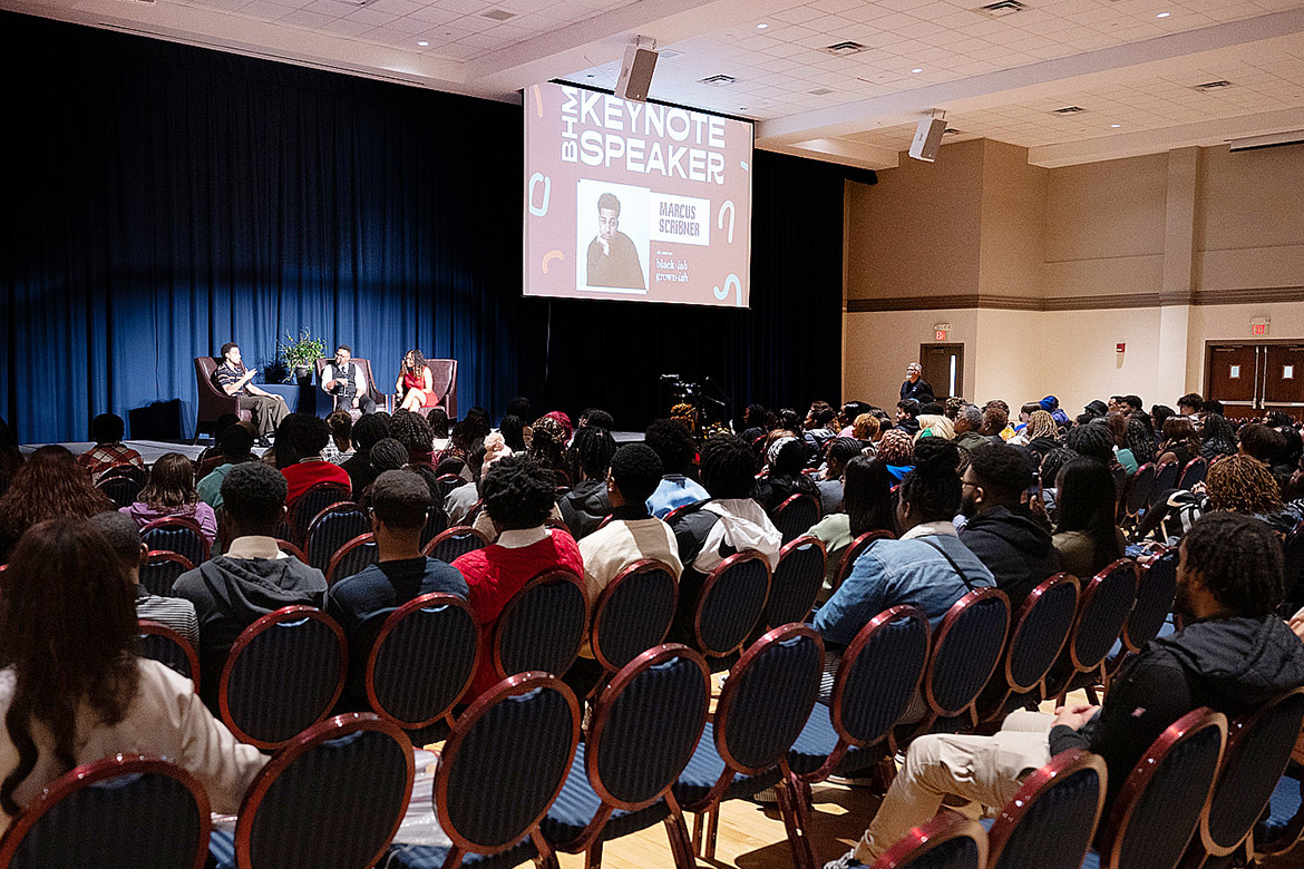 Middle Tennessee State University’s Black History Month keynote speaker Marcus Scribner, far left, best known as Andre “Junior” Johnson in the syndicated comedy series, “Black-ish,” is interviewed on stage Thursday, Feb. 22, by Human Development and Family Sciences major Jaliyah Webb, far right, of Gallatin, Tennessee, and School of Journalism and Strategic Media student Jayden Blair from Nashville, Tennessee. (MTSU photo by James Cessna)