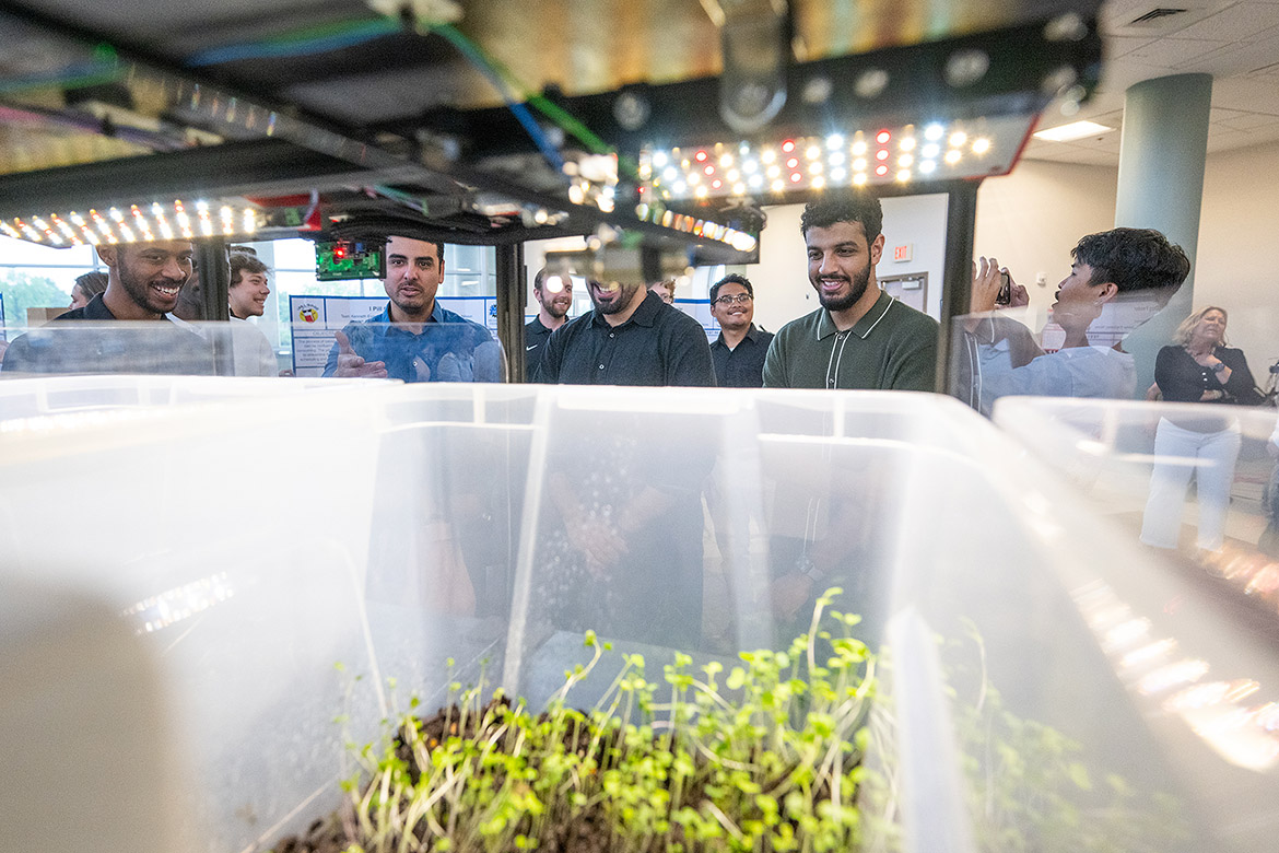 Middle Tennessee State University Engineering Technology Mech-Tech Expo students check out the progress of a plant utilizing grow lighting, one of 35 team presentations during the year-end event to showcase capstone projects. Mech-Tech occurred May 3 at the Miller Education Center on Bell Street in Murfreesboro, Tenn. (MTSU photo by Cat Curtis Murphy)