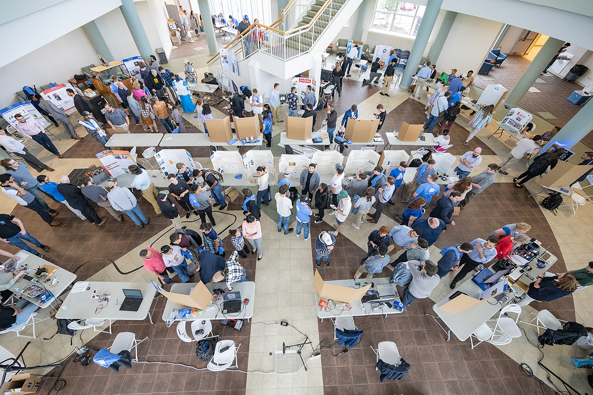 Visitors join Middle Tennessee State University Engineering Technology and Mechatronics Engineering students at the annual study day Mech-Tech event, showcasing their senior projects ranging from robots to hovercraft to automated gardens and more. (MTSU photo by Cat Curtis Murphy)