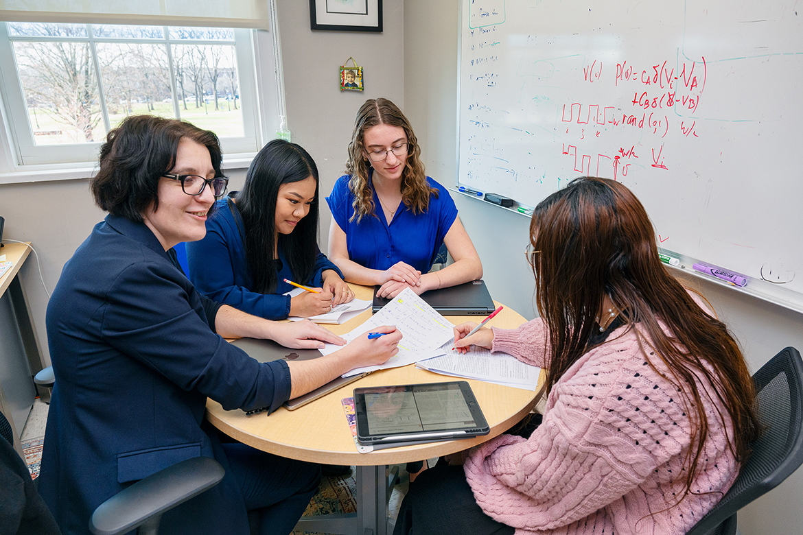 Hanna Terletska, left, Middle Tennessee State University Department of Physics and Astronomy associate professor and director of the quantum and AMPLIFY research programs, confers with Pratanna Thamsorn of Smyrna, Tenn., Ariel Nicastro of Franklin, Tenn., and Monika Fouad of Antioch, Tenn., about their projects. (MTSU photo by Andy Heidt)