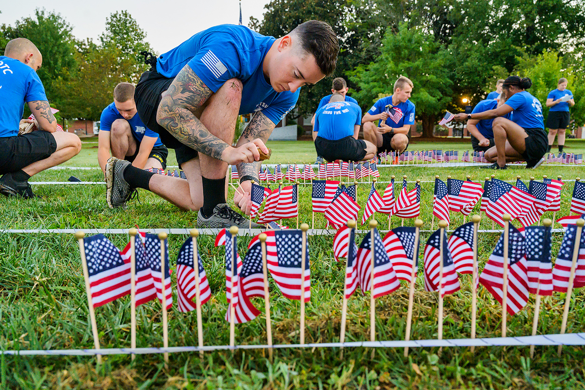 MTSU senior ROTC cadet Michael Maynard of Pleasant View, Tenn., and nearly 60 cadets, student veterans, SGA officers and others place nearly 3,000 small U.S. flags in the ground to commemorate the 20th anniversary of 9/11 on Friday, Sept. 10, near the Veterans Memorial outside the Tom H. Jackson Building on campus. (MTSU photo by Andy Heidt)