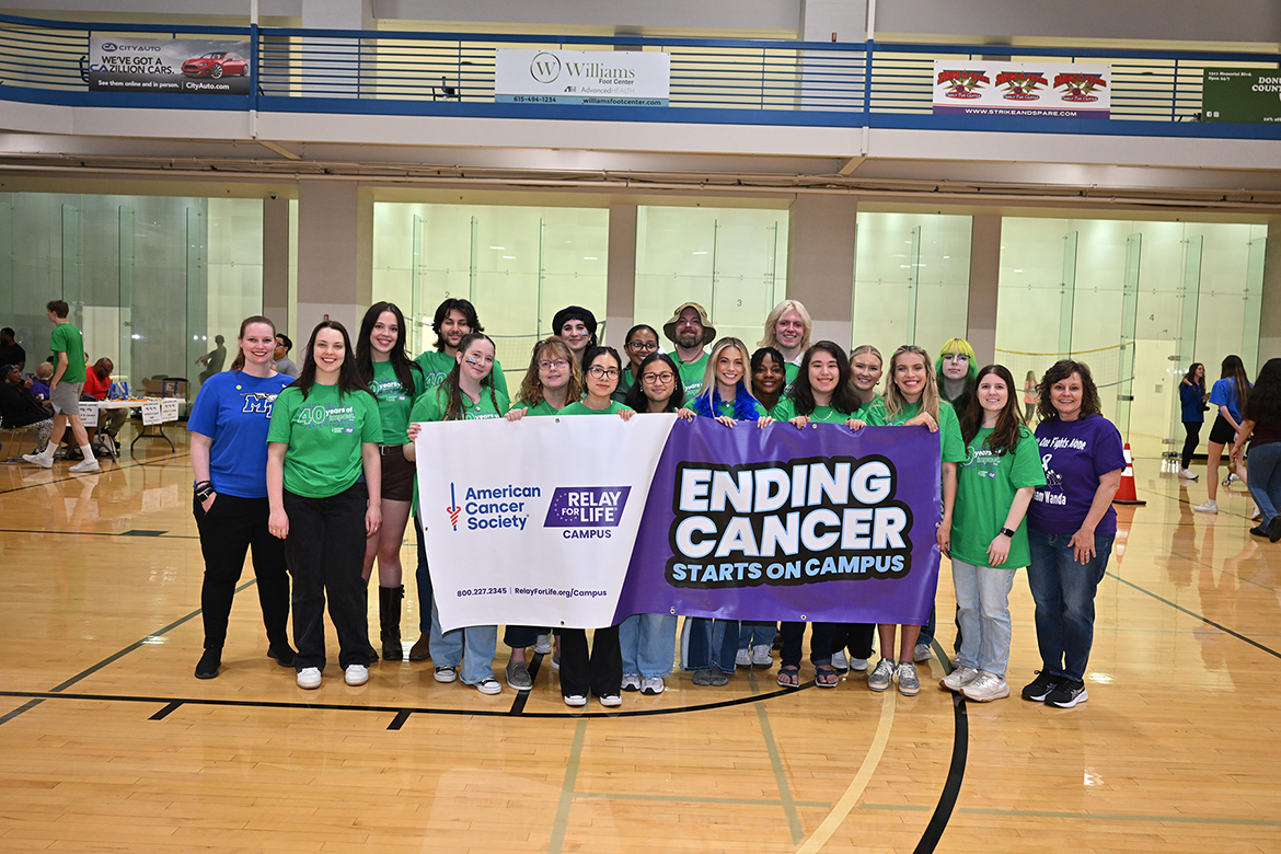 The student-led Middle Tennessee State University Relay for Life committee gathers during the annual American Cancer Society fundraising event Friday, March 28, in the Campus Recreation Center gym on campus in Murfreesboro, Tenn. The group, which had been planning and organizing the efforts since last fall, raised $12,000. (MTSU photo by James Cessna)