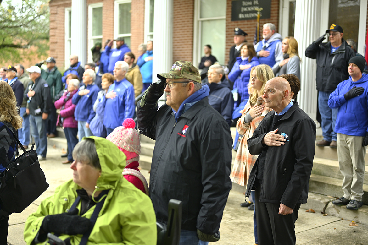 Veterans, including Middle Tennessee State University's Keith M. Huber, foreground right, listen to the playing of reveille during an early portion of the 40th annual Salute to Veterans and Armed Forces game 's Memorial Service at the MTSU Veterans Memorial sight in November 2022. MT Athletics and the MTSU Charlie and Hazel Daniels Veterans and Military Family Center will host numerous activities as part of the MT Blue Raider-FIU football game to celebrate veterans and active-duty military. Huber is senior adviser for veterans and leadership activities. (MTSU file photo by Cat Curtis Murphy)