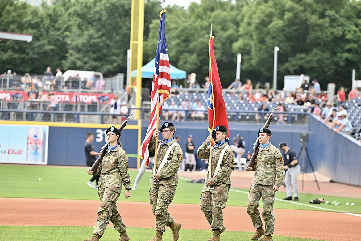 Middle Tennessee State University ROTC color guard members, from left, Keira Warren, Ridge Boehms, Shaun Debien and Samuel Carlson bring the American and state flags onto the field before the playing of the national anthem during the Sunday May 25, MTSU True Blue Day and Sounds’ Salute to Armed Forces game that eventually was rained out at First Horizon Park in Nashville, Tenn. (MTSU photo by James Cessna)