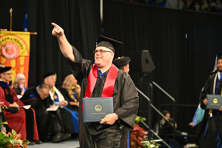 A proud Middle Tennessee State University graduating student-veteran celebrates his hard-earned degree during the spring 2025 morning commencement ceremony held Saturday, May 10, inside Murphy Center on the MTSU campus in Murfreesboro, Tenn. (MTSU photo by James Cessna)