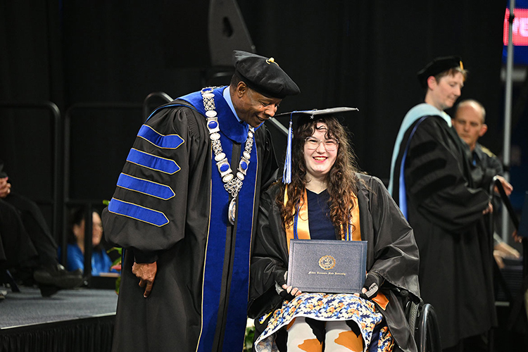 Middle Tennessee State University President Sidney A. McPhee congratulates a proud graduate during the spring 2025 afternoon commencement ceremony held Saturday, May 10, inside Murphy Center on the MTSU campus in Murfreesboro, Tenn. (MTSU photo by Creative and Visual Services)