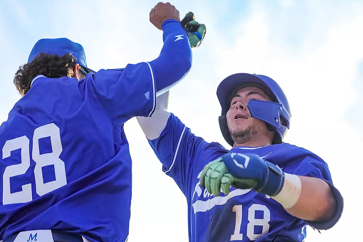 Middle Tennessee State University redshirt sophomore outfielder Hayden Miller, left, of Sandy Hook, Conn., greets teammate and cleanup hitter Brett Vondohlen near the dugout after Vondohlen, a redshirt sophomore from Murfreesboro, hit a solo home run March 18 during an 11-7 loss to visiting Southeast Missouri State University at Reese Smith Jr. Field in Murfreesboro, Tenn. The Blue Raiders will entertain Louisiana Tech April 11 (6 p.m.), April 12 (4 p.m.) and April 13 (1 p.m.) during the annual MTSU Spring Showcase. (MTSU photo by Michael J. Giglio Photography)