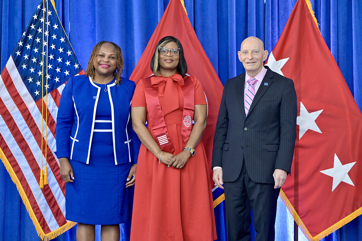 Zandra Pickett, center,a Middle Tennessee State university graduating senior, receives a red stole from Keith M. Huber, right, senior advisor for veterans and leadership initiatives, and Khalilah Doss, vice president of Student Affairs, Thursday, May 8, during the 30th Graduating Veteran Stole Ceremony at the Miller Education Center’s second-floor atrium. Nearly 60 students, who will graduate on Friday and Saturday, May 9-10, in ceremonies in Murphy Center, attended the ceremony. (MTSU photo by Andy Heidt)