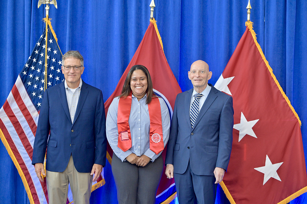 Florry “Flo” Holden, center, of Murfreesboro, Tenn., is flanked by Middle Tennessee State University Provost Mark Byrnes, left, and Keith M. Huber, senior adviser for veterans and leadership initiatives, Thursday, Aug. 7, during the summer 2025 Graduating Veterans Stole Ceremony in the Miller Education Center’s second-floor atrium on Bell Street in Murfreesboro. Holden served in the U.S. Navy. (MTSU photo by Andy Heidt)