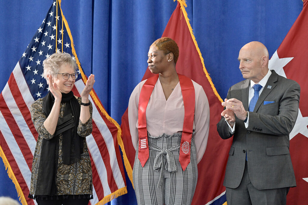 MTSU's Deb Sells, left, vice president of Student Affairs, and Keith M. Huber, senior adviser for veterans and leadership initiatives, show their approval after Sells shared how Tatyana Brasswell had overcome obstacles and became the first recipient of the Avery King Memorial Scholarship this semester. On Wednesday, April 27, at the Miller Education Center, Brasswell and nearly 65 others were recognized with red stoles to wear at commencement in May. (MTSU photo by Andy Heidt)