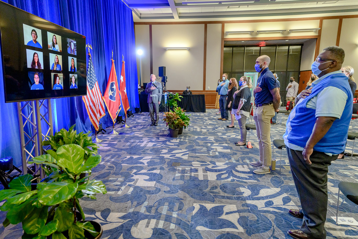 Members of the MTSU Alumni Choir, virtually left, from the School of Music perform the national anthem during the in-person spring Graduating Veterans Stole ceremony at the MT Center in the Sam Ingram Building Wednesday, April 28. The event recognized graduating student veterans and ROTC cadets. (MTSU photo by J. Intintoli)