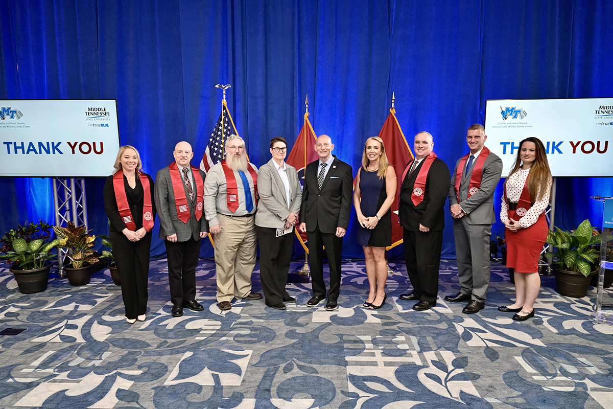 MTSU administrators join honorees recognized Wednesday, July 28, during the summer Graduating Veterans Stole Ceremony in the Ingram Building’s MT Center on campus. Participants include Heather Beardsley, left, Bryan Swanson, Michael Kramer, Anne Anderson, Keith M. Huber, Hilary Miller, Michael Betzold, Corbitt Huseth and Cynthia Jensen. The event marked the 20th Stole Ceremony since May 2015. (MTSU photo by Andy Heidt)