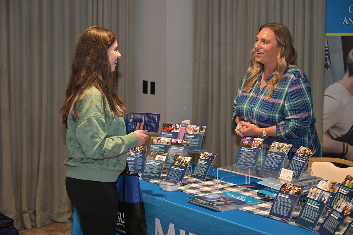 A prospective Middle Tennessee State University student from Sumner County learns more about the media-related majors and opportunities available from Janell Fisher, director of advising with the Scott Borchetta College of Media and Entertainment, during Middle Tennessee State University’s True Blue Tour student reception at Grasslands Country Club in Gallatin, Tenn., on Thursday, Oct. 23. (MTSU photo by James Cessna)