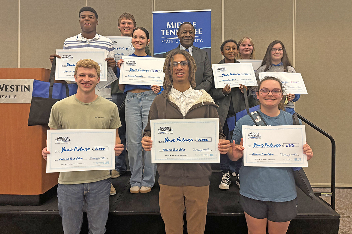 Middle Tennessee State University President Sidney A. McPhee, back row center, is shown with Alabama and southern Middle Tennessee scholarship recipients attending the recent MTSU True Blue Tour recruiting event at the Westin Hotel in Huntsville, Ala. (MTSU photo by Randy Weiler)