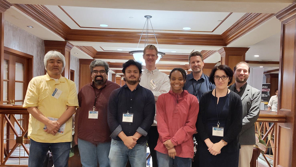 From left, Fisk University research associate professor Akira Ueda, Middle Tennessee State University postdoctoral researchers Anirudha Mirmira and Wasin Mondal, Oak Ridge National Laboratory senior research scientist Tom Berlijn, Fisk student researcher India Gooch, ORNL distinguished researcher Thomas Maier and MTSU physics faculty members Hanna Terletska and John Villanova participate in an ORNL-organized scientific meeting Aug. 12-13 at the Crowne Plaza Hotel in Knoxville, Tenn. Tennessee Quantum Materials Workforce Development and Training program, or TN-QuMat, students, postdoctoral researchers and principal investigators from MTSU, Tennessee State University, Fisk University and ORNL were among session attendees. (Submitted photo)