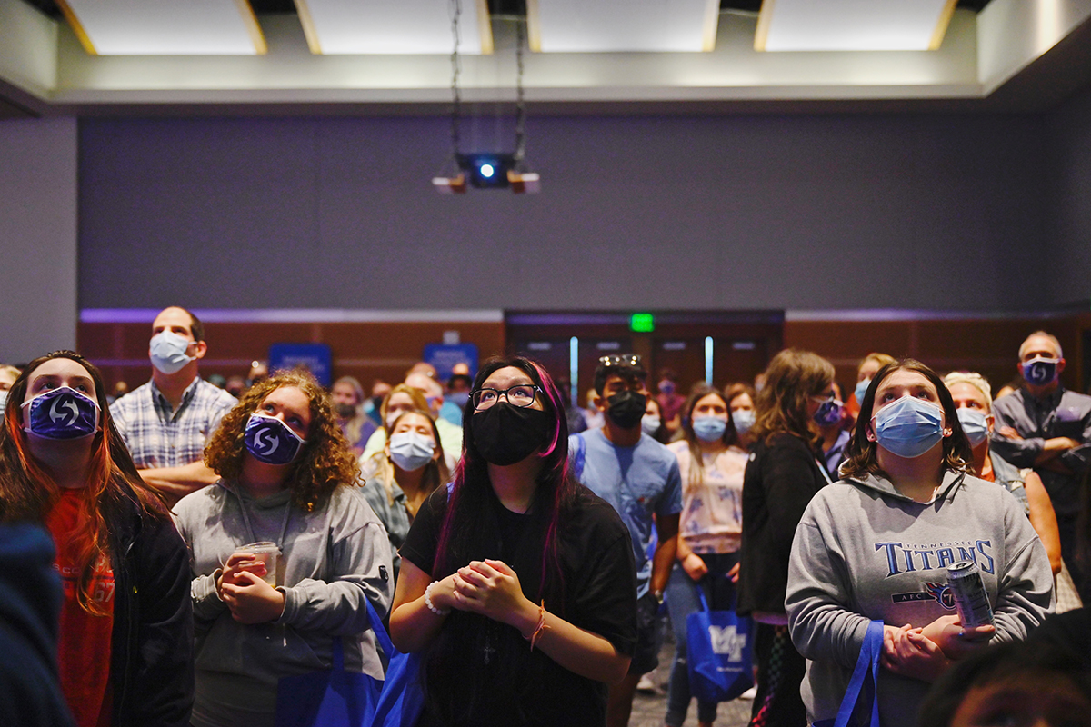 Prospective MTSU students and their parents watch a video during the kickoff event for the True Blue Tour recently in the Student Union Ballroom on campus. Campus officials visit 14 cities in four states during the fall recruiting season. (MTSU photo by Cat Curtis Murphy)