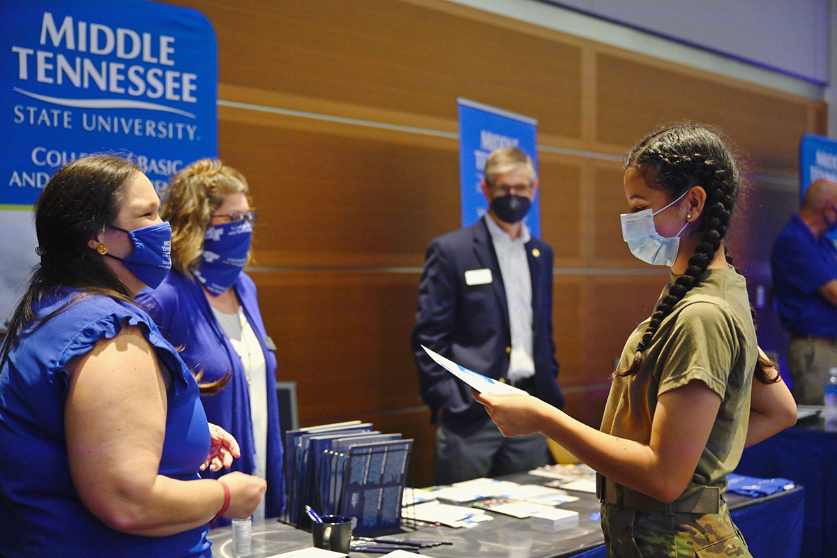 A prospective MTSU student gathers information about the College of Basic and Applied Sciences table during the recent True Blue Tour event for Murfreesboro, Rutherford County and the surrounding area. The event, held in the Student Union Ballroom, was the kickoff for the 14-city True Blue Tour across Tennessee and three other states. (MTSU photo by Cat Curtis Murphy)