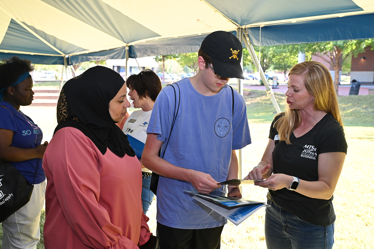 Sam Zaza, left, associate professor in Information Systems and Analytics at Middle Tennessee State University, listens as Abby Davis, right, an advisor in the Jones College of Business, explains program offerings to a prospective student Sept. 30 during the True Blue Preview in the Student Union Courtyard. Zaza later told the potential student about different information systems career paths. Hundreds of students are expected to attend the 9 a.m. Saturday, Nov. 4, preview event. (MTSU file photo by James Cessna)