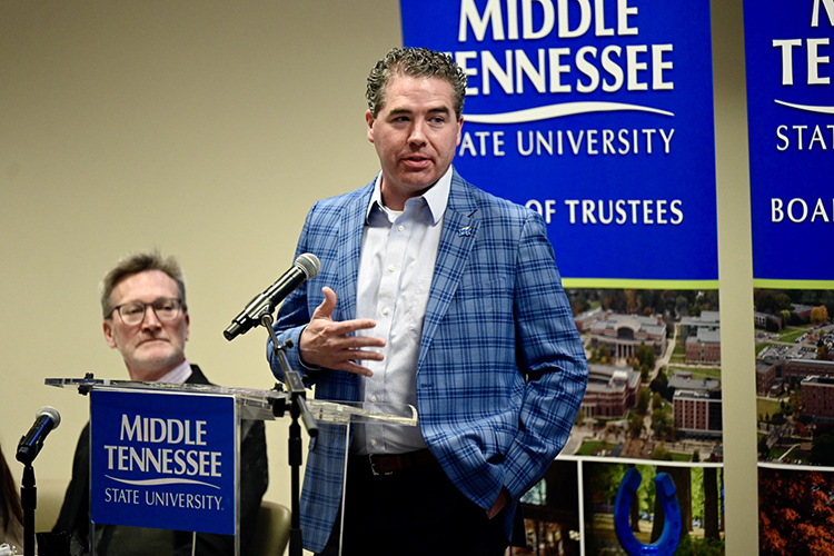 MTSU men’s basketball coach Nick McDevitt thanks trustees and the Blue Raider campus for its support during a highly successful turnaround season during the Tuesday, April 5, Board of Trustees quarterly meeting inside the Miller Education Center on Bell Street. McDevitt and women’s coach Rick Insell were both recognized for their teams’ success. Looking on, at left, is Faculty Trustee Rick Cottle. (MTSU photo by J. Intintoli)