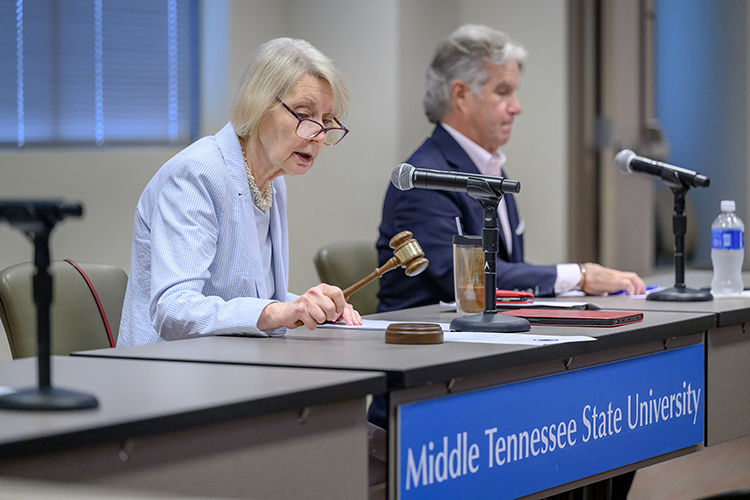 Christine Karbowiak Vanek, left, vice chair of the Board of Trustees at Middle Tennessee State University in Murfreesboro, Tenn., presides over a special board meeting about the institution’s policies for naming its facilities related to an external request to name a new facility after Board Chairman Stephen Smith and his wife, Denise. Smith has recused himself from the matter and did not attend the meeting, which was held Tuesday, May 27, at the Miller Education Center. At right is Trustee Bill Jones. (MTSU photo by J. Intintoli)