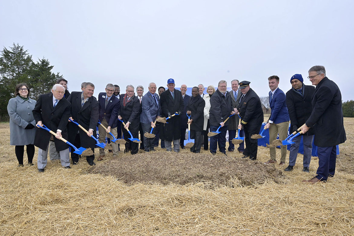 Performing the ceremonial shoveling of dirt during the groundbreaking ceremony held Wednesday, Dec. 3, for the new $73.4 million, state-of-the-art Middle Tennessee State University Aerospace facility that will be built at the Shelbyville Municipal Airport in Shelbyville, Tenn., are, front row, from left, MTSU Board of Trustees member J.B. Baker; Shelbyville airport manager Paul Perry; MTSU Basic and Applied Sciences Dean Greg Van Patten; Shelbyville Mayor Randy Carroll; state Rep. Pat Marsh; Board of Trustees Chair Steve Smith; MTSU President Sidney A. McPhee; state Rep. Tim Rudd; Delta Airlines pilot Eric Wesley; and MTSU aerospace pro-pilot student Ty Welk; and back row, from left, MTSU faculty trustee Kari Neely; state Sen. Dawn White; MTSU trustee Pete Delay; MTSU student trustee Michai Mosby; and MTSU trustees Bill Jones, Michael J. Wade, Jimmy Granbery, Tom Boyd, Vice Chair Christine Karbowiak Vanek, and John Floyd. (MTSU photo by Andy Heidt)