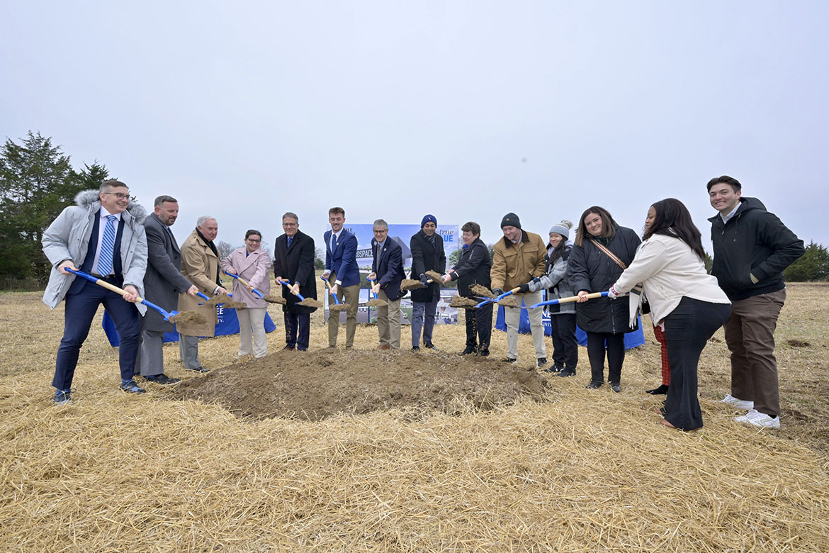 Middle Tennessee State University Aerospace Department students and faculty, along with MTSU administrators, perform the ceremonial shoveling of dirt during the groundbreaking ceremony held Wednesday, Dec. 3, for the new $73.4 million MTSU Aerospace facility that will be built at the Shelbyville Municipal Airport in Shelbyville, Tenn., are members of the (MTSU photo by Andy Heidt)